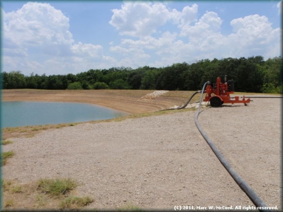 Un-lined open pit frac pond at Chesapeake KISD Site on US 287 in Arlington, Texas